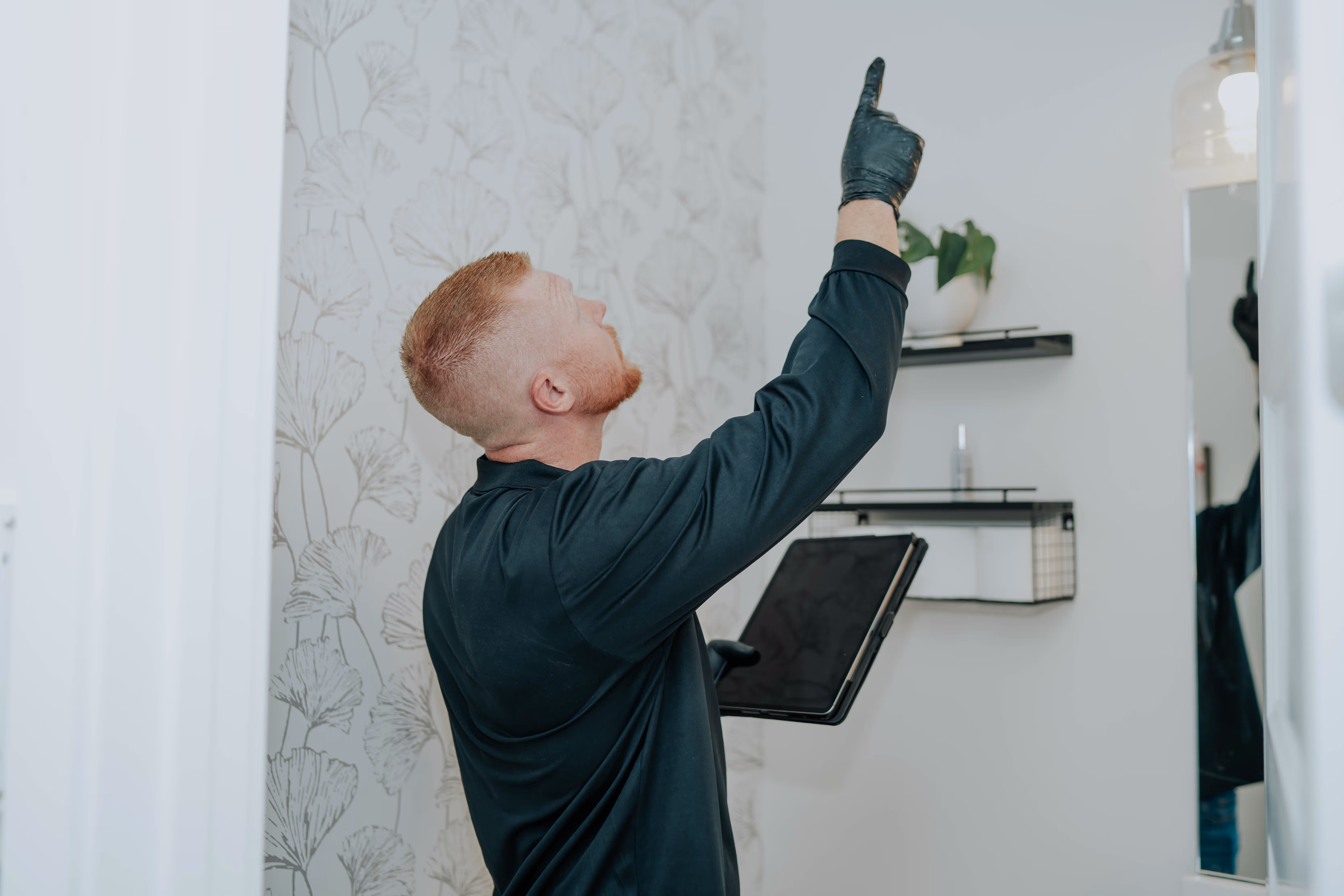 A North State Pure Maintenance technician inspecting a Northern California home